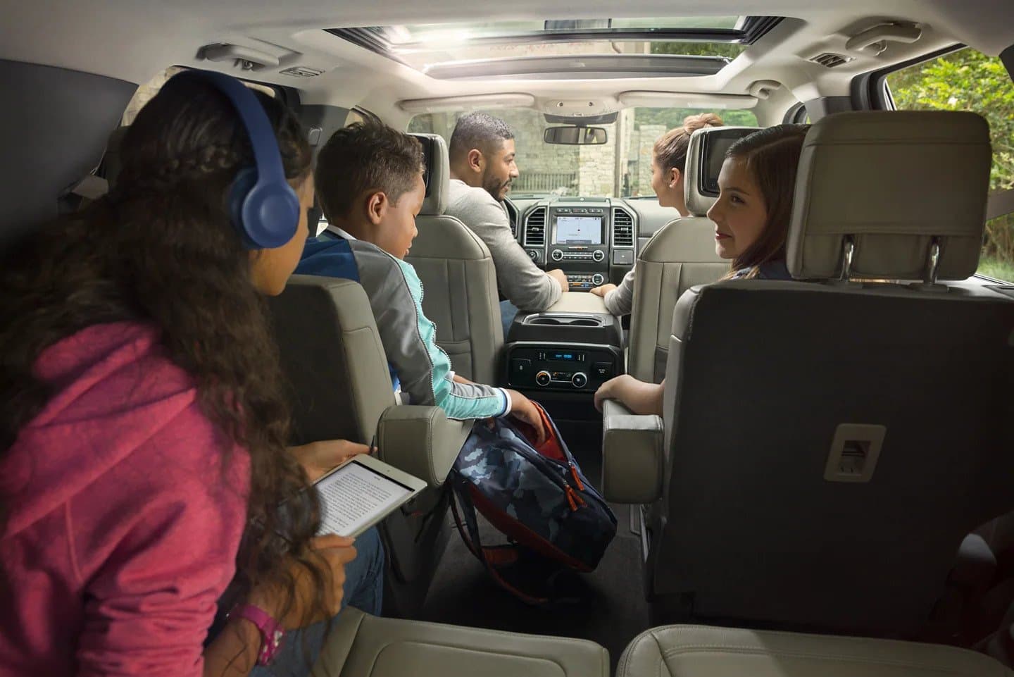 Clean, vacuumed SUV interior with second-row seating visible